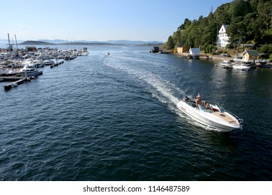 Oslo, Norway - July 22, 2018: Motor Boat Sails To The Harbor In Oslo Fjord.  Motorboat Rides Between Islands In Oslofjord. 
