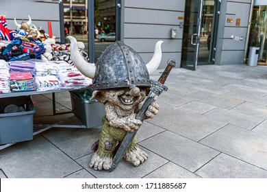 Oslo, Norway July 26, 2013: a Stone Troll figure on a street in Oslo, Norway at the entrance to a store. Trolls are evil characters in popular Scandinavian folklore.
