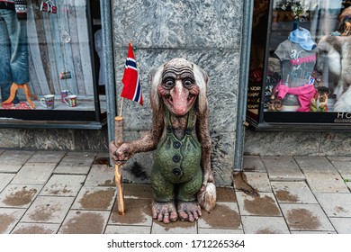 Oslo, Norway July 26, 2013: A Stone Troll Figure On A Street In Oslo, Norway At The Entrance To A Store. Trolls Are Evil Characters In Popular Scandinavian Folklore. Editorial