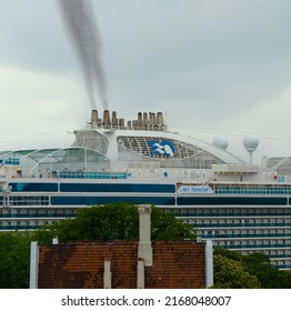 Oslo, Norway - June 12th - 2022: Black Exhaust Smoke Coming Out Of The Smoke Stack Of A Large Passenger Cruise Ship Docked In The Port Of Oslo.