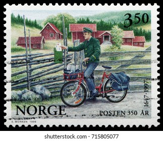 Oslo, Norway - June 19, 1996: Postman Were Using Bicycle For Rural Mail Delivery. Stamp Issued By Norwegian Post In 1965.