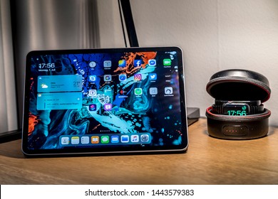 Oslo, Norway - June 23rd 2019: Testing the new apple public beta version of the ipados 13 on a new iPad Pro 2018 with support of an Apple Watch 4 on a desk in a hotel in Oslo Norway Scandinavia.