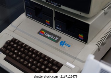 Oslo, Norway. May 01, 2022: Aged Apple II Computer And Hand Insert Floppy Inside.