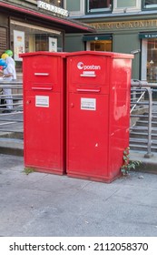 Oslo, Norway - September 25, 2021: Red mail post box of Norwegian post service provider Posten Norge.