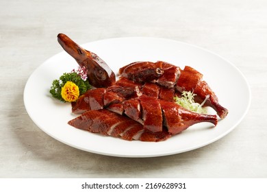 Osmanthus-infused Crispy Roasted Duck served in a dish isolated on grey background