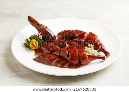 Osmanthus-infused Crispy Roasted Duck served in a dish isolated on grey background