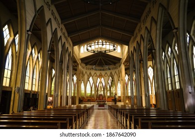 Osorno, Chile - February, 2020: Interior Of Church St. Matthew's Cathedral In Osorno. Catholic Church Interior With Empty Benches, Columns And Jesus Christ In A Middle. Chile.