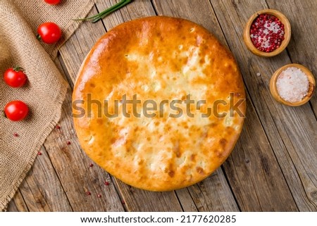 Ossetian pie with cabbage on old wooden table Stock photo © 