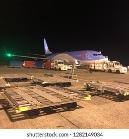 OSTEND, BELGIUM - JULY 29, 2018: Blue Holiday Airplane Stands At Airport Tarmac During The Night Evening