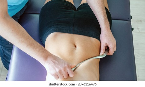 Osteopath Performing Diaphragm Coastal Release With IASTM Tool, Instrument Assisted Soft Tissue Mobilization Technique For Soft Tissue Treatment