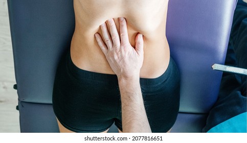 Osteopath Performing Diaphragm Coastal Release With His Hand, Instrument Assisted Soft Tissue Mobilization Technique For Soft Tissue Treatment