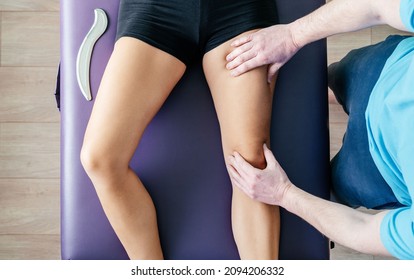 Osteopath performing myofascial release for quadriceps