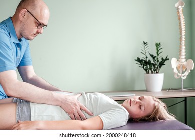 Osteopath Practitioner Releasing The Diaphragm Of A Female Patient, Rib Cage Release Massage, Breathing Muscle Relaxation