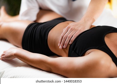 Osteopathist Working with Female Patient - Powered by Shutterstock