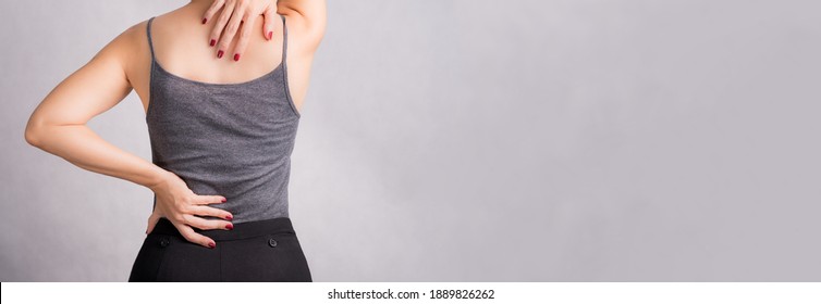 Osteoporosis Day Beautiful Woman Stressed Massaging Her Painful Body Suffering From Back - Neck Pain. Herniated Disc, Osteopathy, Physiotherapy, Office Syndrome, Alternative Medicine, Woman Health