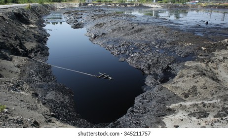 OSTRAVA, CZECH REPUBLIC - AUGUST 3, 2015: The Former Dump Toxic Waste In Ostrava, Oil Lagoon, Ostramo, Effects Nature From Soil Contaminated With Chemicals And Oil, Moravia-Silesia Region, Europe, EU