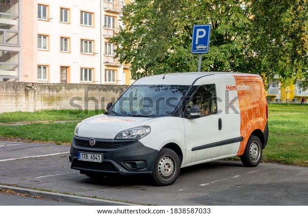 OSTRAVA, CZECH\
REPUBLIC - OCTOBER 3, 2020: The of small white-orange Fiat Doblo\
van car of the Heimstaden company offering the rental and real\
estate services in Czech\
Republic