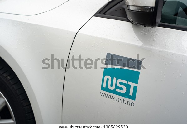 OSTRAVA, CZECH\
REPUBLIC - OCTOBER 5, 2019: The logo of NST Nippon Steel Welding\
and Engineering (NSWE) company on a white car. The company is a\
supplier of welding\
consumables.