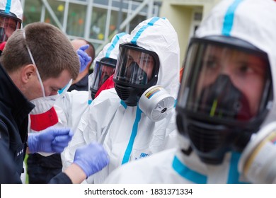 Ostrava, Czech Republic - October 8 2020: Firefighters With Protective Suits And Masks Against Coronavirus During Disinfection And Decontamination Of Retirement Home Due To The Occurrence Of Covid 19