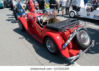 Ostrava, Czechia - 06.05.2022: High Angle From Behind Shot Of Red Panther Lima MK1 Convertible Veteran Car. People Admiring Retro Cars During Veteran Rallye Event In The City. 