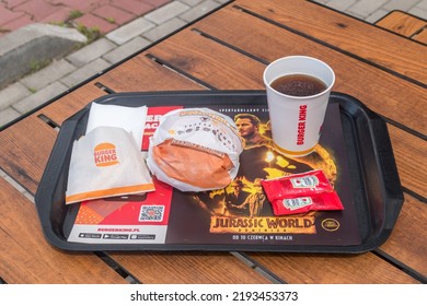 Ostroda, Poland - June 17, 2022: Burger King Menu With French Fries, Chilli Cheese King Sandwich And Ice Tea For Drink.