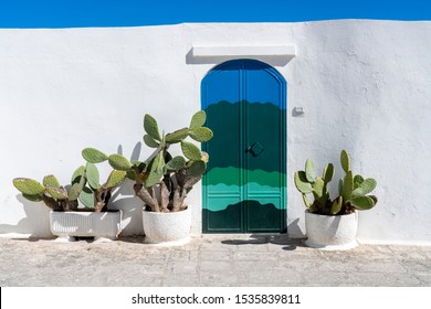 Ostuni, Puglia / Italy -April 30, 2019: The white city of Ostuni is one of many preserved historic hilltop villages in Puglia and is surrounded by a large white wall