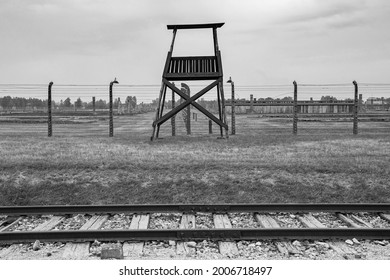 Oswiecim, Poland - July 11th 2018. A guard tower and barbed wire fences in the Birkenau Auschwitz II concentration camp in Poland
