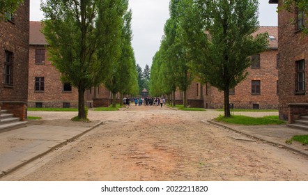 Oswiecim, Poland - July 11th 2018. Visitors walk around the Auschwitz concentration camp in Poland in the rain