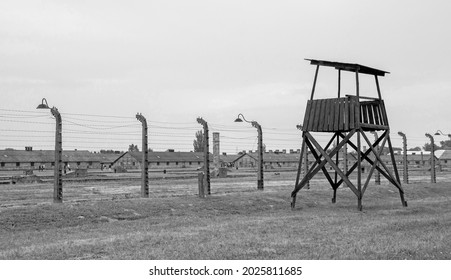 Oswiecim, Poland - July 11th 2018.  A guard tower and barbed wire fences in the Birkenau Auschwitz II concentration camp in Poland
