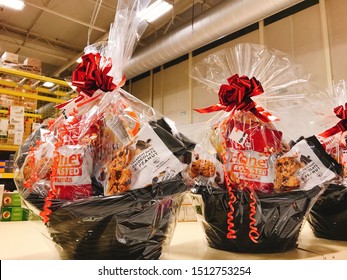 Otago/New Zealand: Basket Of Gift With Chocolate Peanut Salted Peanuts Dessert With Wrapped Red Ribbon Black Basket 