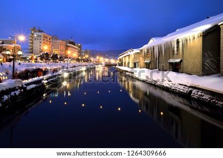 Otaru canal famous place in winter. This place have snow festival every year and on the foot path beside canal have candle light show along the walkway. Photo taken in the twilight in Hokkaido, Japan