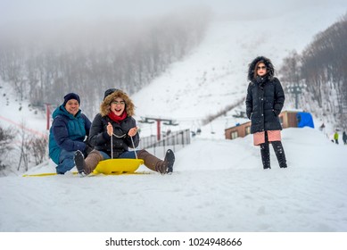 Otaru, Hokkaido-January 09, 2018; Family Playing On Snow Sledding With Trey Or Snow Rafting At Winter Festival In Otaru, Hokkaido, Japan