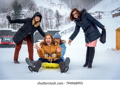 Otaru, Hokkaido-January 09, 2018; Women Playing On Snow Sledding With Trey Or Snow Rafting At Winter Festival  In Otaru, Hokkaido, Japan