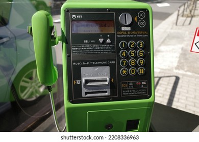 Otemachi, Tokyo, Japan - September 27 2022: A Green Public Pay Phone In A Phone Booth In Tokyo.