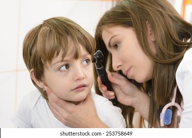 Otolaryngologist Examining A Kid Ear In A Clinic