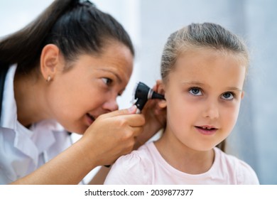 Otolaryngology Infection. Child Doctor Checking Ear Using Otoscope