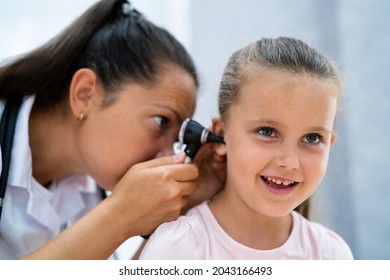 Otolaryngology Infection. Child Doctor Checking Ear Using Otoscope