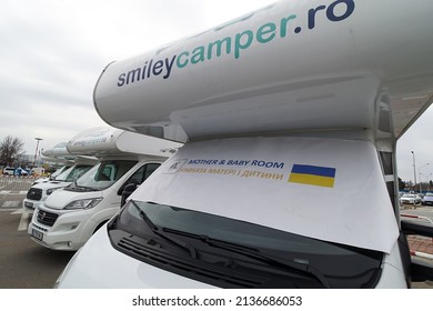 Otopeni, Romania - March 17, 2022: Temporary Accommodation For War Refugee With Children From Ukraine In Motorhomes Provided By A Private Company At Bucharest Henri Coanda International Airport.