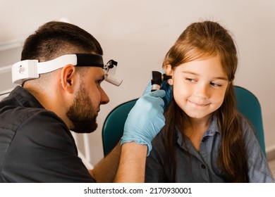 Otoscopy Of Child Ears With Otoscope. ENT Doctor. Consultation With Pediatric Otolaryngologist. Treatment Of Childs Ear Pain