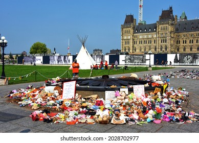 Ottawa - Aug 21, 2021: TeePee Erected On Parliament By Indigenous People In Order To Effect More Reconciliation From Govt. Toys Left In Memory Of The Residential School Children Are Still In Place