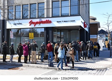 Ottawa, Canada - April 1, 2019: Customers Wait In Line To Enter The Mariuana Dispensary On The First Day For Legal Retail Store Sale Of Cannabis In Ontario.  