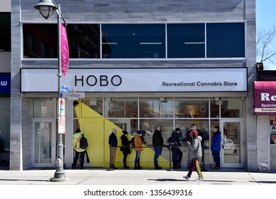 Ottawa, Canada - April 1, 2019: Customers wait in line to enter the Hobo Recreational Cannabis store on Bank St the first day for legal retail store sale of cannabis in Ontario.  