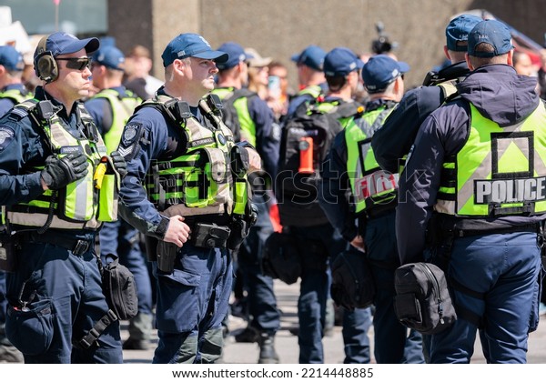 Ottawa, Canada – April 30
2022: Ottawa Police and other first responders control a crowd
gathered at the Canadian War Memorial during Rolling Thunder convoy
protests