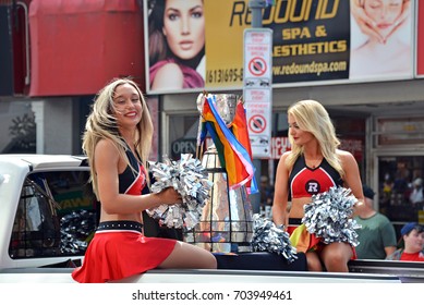 OTTAWA, CANADA - AUG27, 2017: Ottawa Redblacks Cheerleaders Ride With The Grey Cup In The Ottawa Pride Parade.  The Team Are The Reigning Canadian Football League Champions.