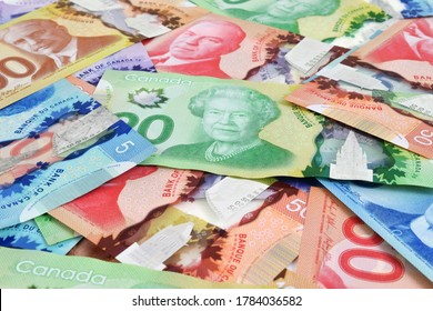 Ottawa, Canada - Jul 25, 2020: A Scramble Of Canadian Dollar Banknotes Illustrative Image Concept For Canadian Economic Business Development. These Frontier Series Was First Circulated In 2011.