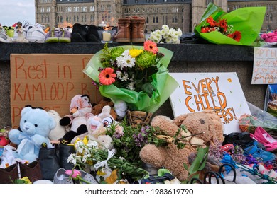 Ottawa, Canada. June 1, 2021. Memorial in tribute to 215 aboriginal children whose remain found in Residential School in Kamloops. Flowers, Toys and shoes dropped in memory