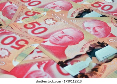 Ottawa, Canada - May 22, 2020: $50 (Fifty) Canadian dollar banknotes illustrative image concept for Canadian economic business development. It was introduced into circulation on March 26, 2012.