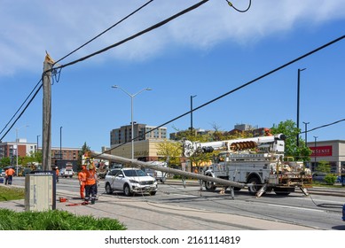 Ottawa, Canada - May 25, 2022:  Hydro Workers Replacing Downed Power Pole Snapped By Wind. A Severe Storm Known As A Derecho Passed Through The Area Causing A Lot Of Damage And Power Outages May 21.