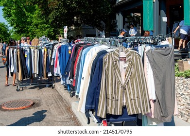 Ottawa, Canada - May 26, 2012: People Browse Used Clothing On Rack At The Annual Glebe Neighborhood Garage Sale Which Takes Place For Several Blocks May 26, 2012 In The Glebe Area Of Ottawa, Ontario. 