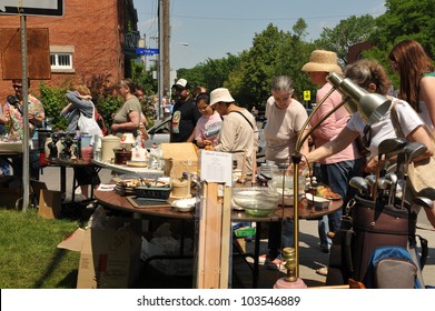 OTTAWA, CANADA - MAY 26: Thousands Of People Gather At The Annual Glebe Neighborhood Garage Sale Which Takes Place For Several Blocks In The Glebe Area Of Ottawa, Ontario May 26, 2012.